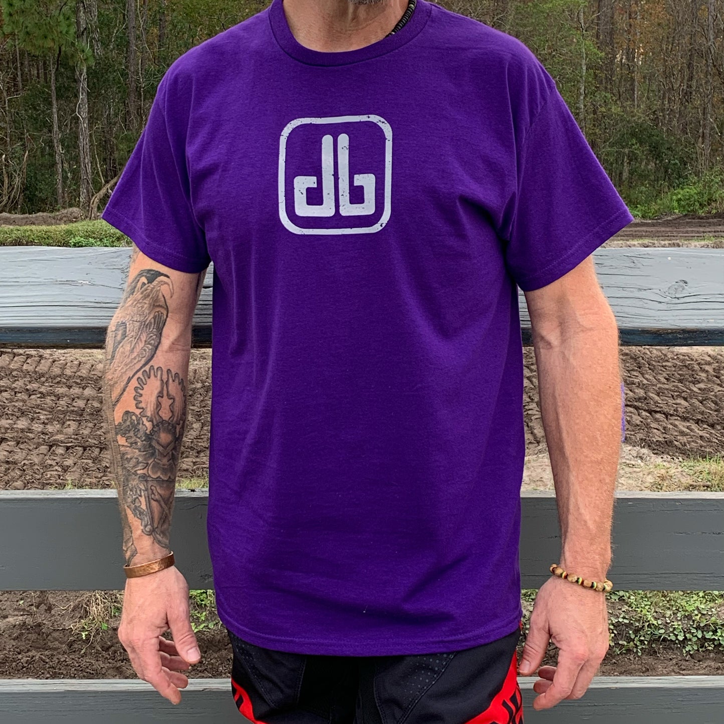 Front view of DirtyBike T-shirt in purple, showcasing minimalist design